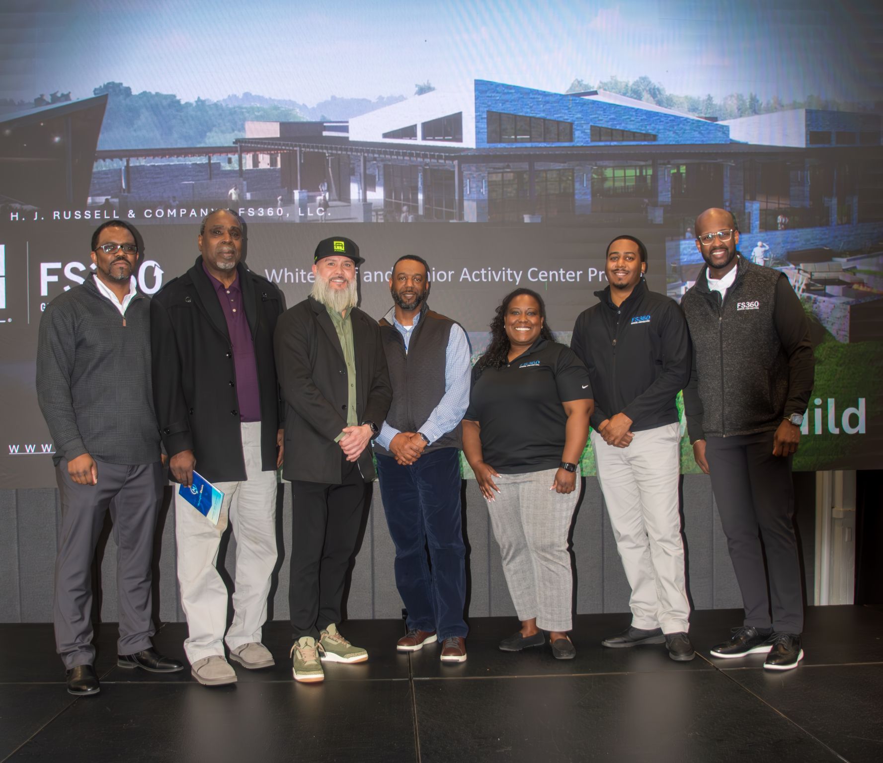 Group of H.J. Russell & Company and FS360 representatives at the John A. White redevelopment project presentation in Atlanta.