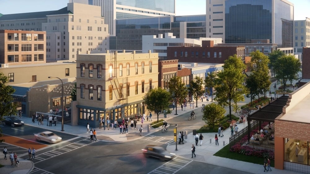 Rendering of South Downtown Atlanta showing restored historic buildings, walkable streets, outdoor dining, and pedestrian activity near Mitchell Street.